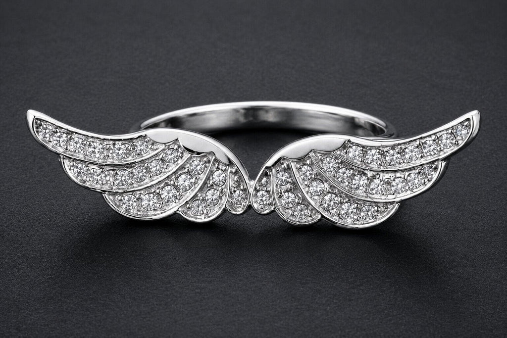 Silver angel wings statement ring with cubic zirconia stones and detailed feather design