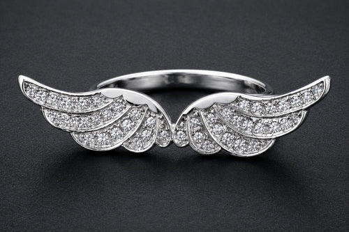 Silver angel wings statement ring with cubic zirconia stones and detailed feather design