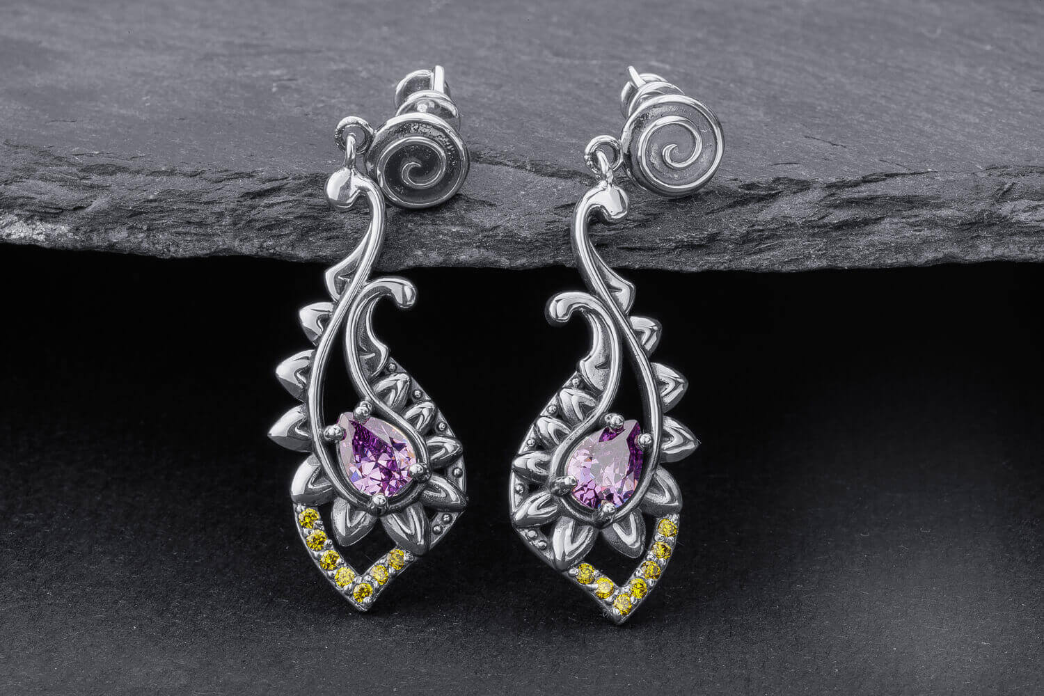 Silver lotus drop earrings with amethyst stones, spiral studs, and yellow accent stones at bottom