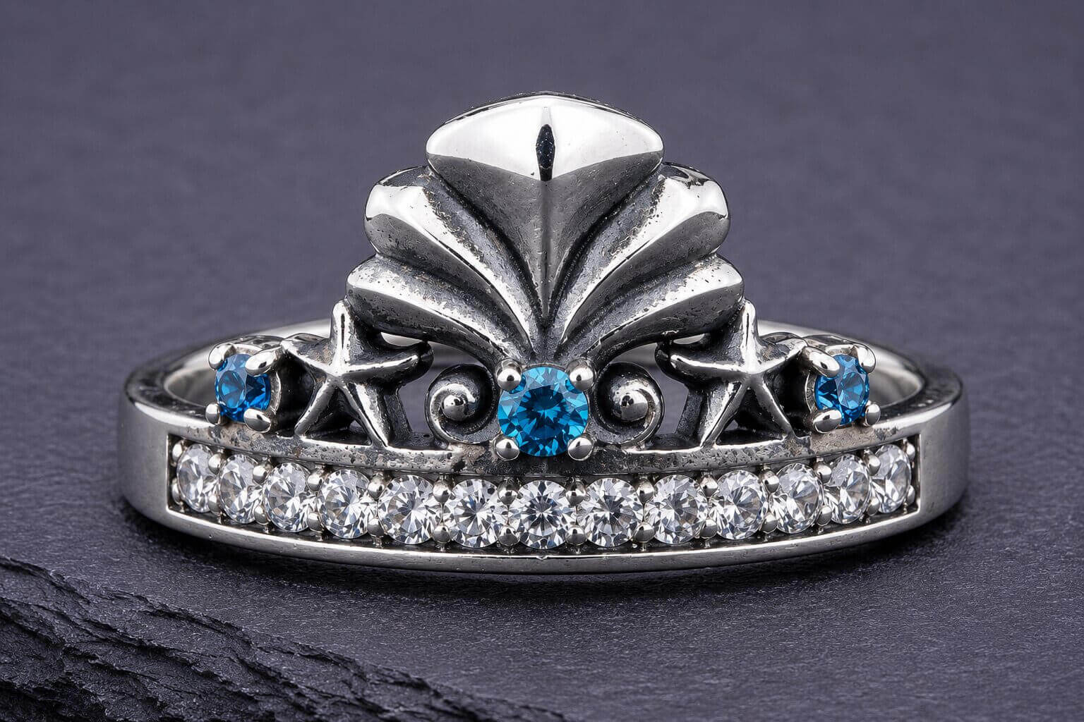 Silver mermaid crown ring with blue topaz stones and seashell design