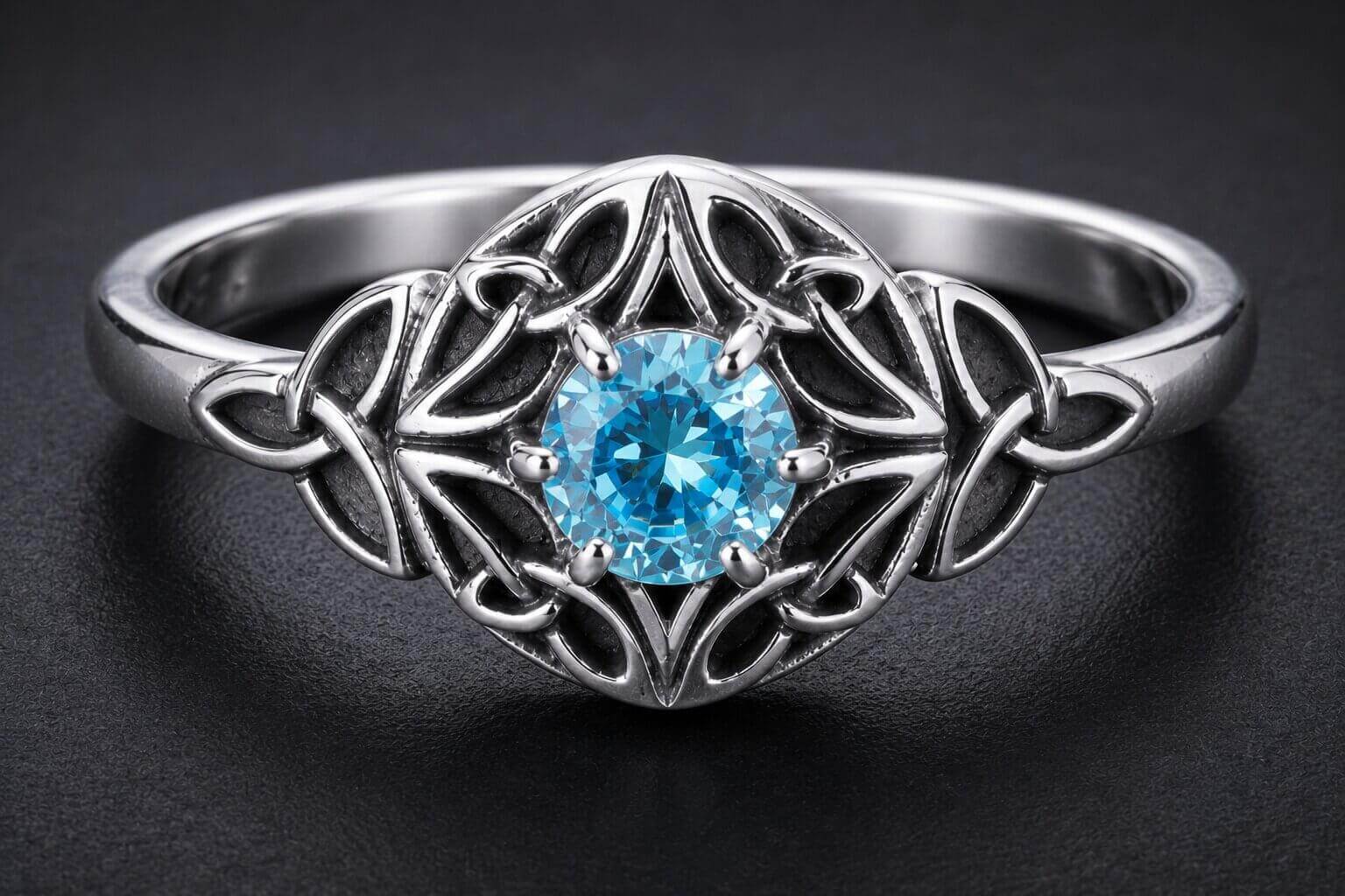 Sterling silver Celtic knot ring with blue cubic zirconia center stone and intricate knotwork design