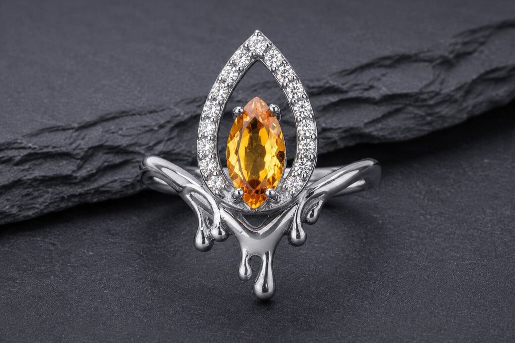 Sterling silver flame halo ring with yellow cubic zirconia center stone and white cubic zirconia halo