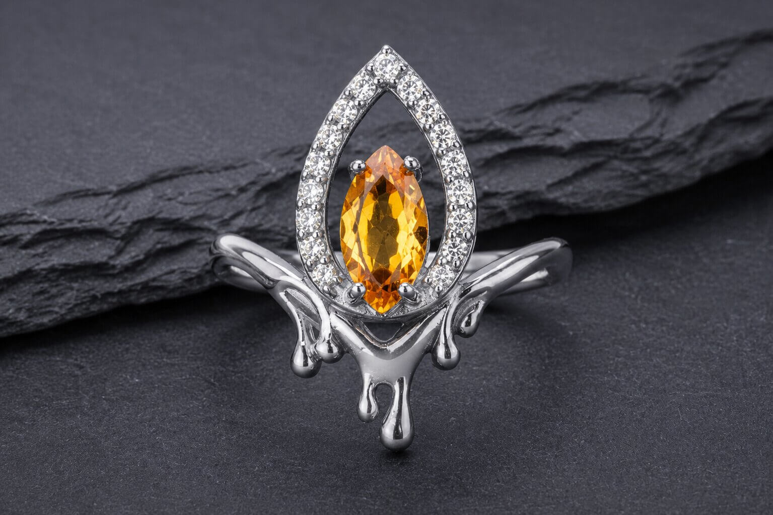 Sterling silver flame halo ring with yellow cubic zirconia center stone and white cubic zirconia halo