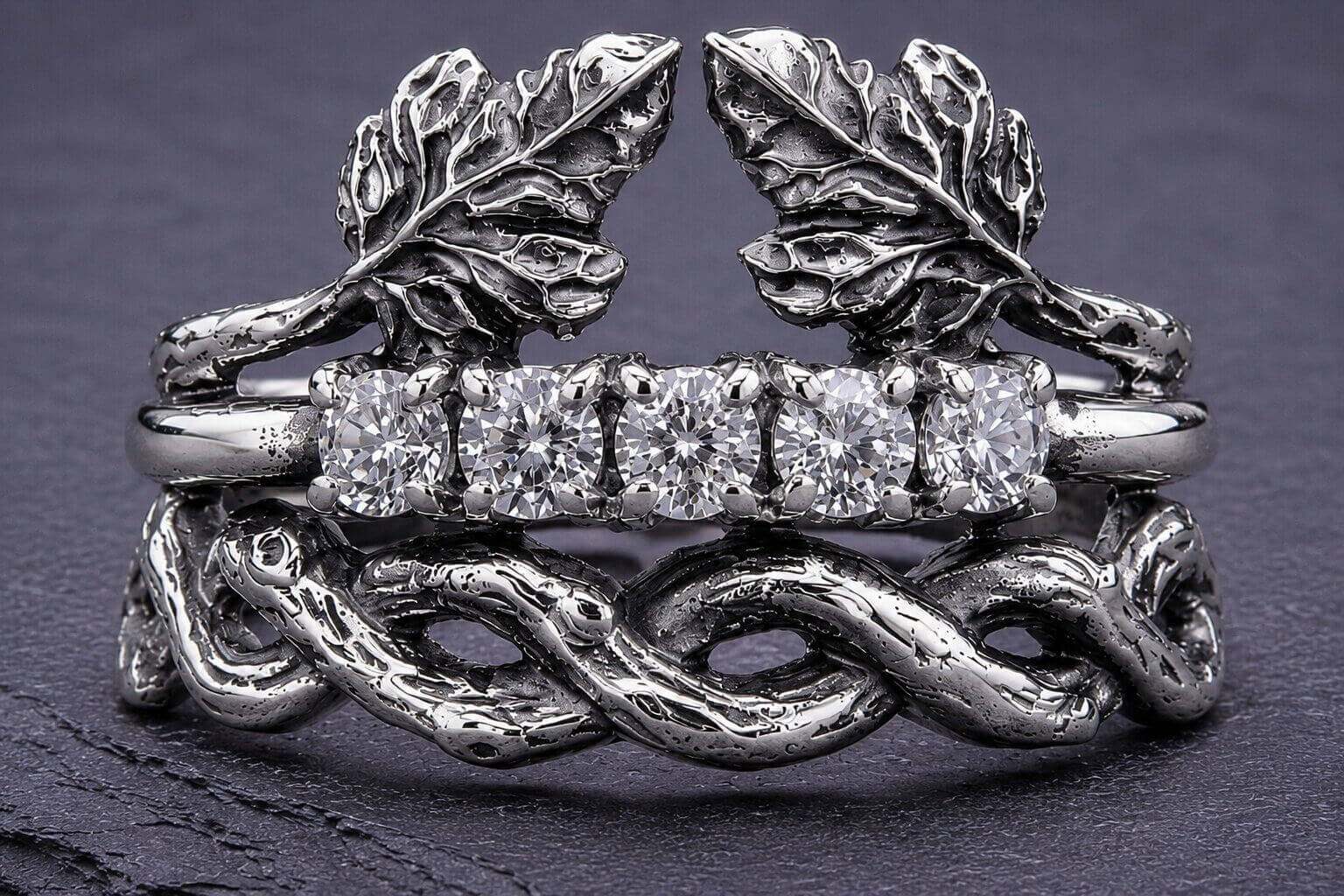 Sterling silver leaf branch stacking ring with three bands featuring detailed leaves, cubic zirconia stones, and twisted branch design