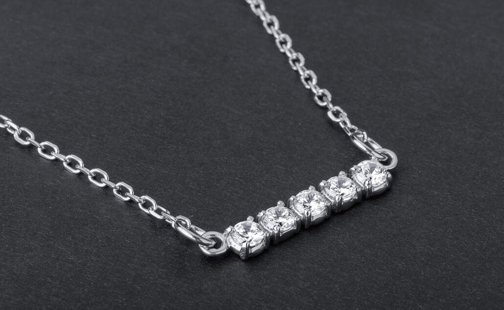 Sterling silver bar necklace with five round cubic zirconia stones