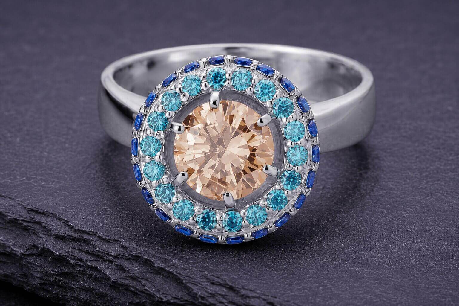 Sterling silver halo ring with champagne center stone and blue accent stones