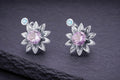 Sterling silver lotus flower stud earrings with purple and blue gemstones