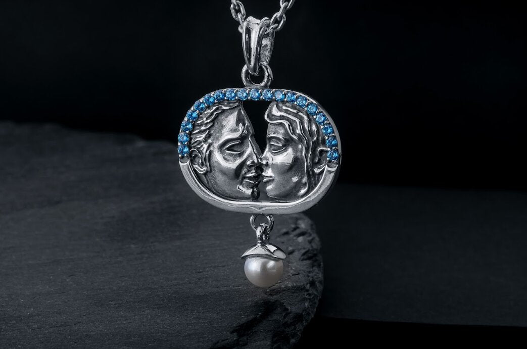 Sterling silver lovers kiss necklace with blue stones and pearl drop
