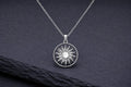 Sterling silver sun necklace with silver rays in circular frame
