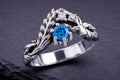Sterling silver leaf ring with blue cubic zirconia stone and accent details